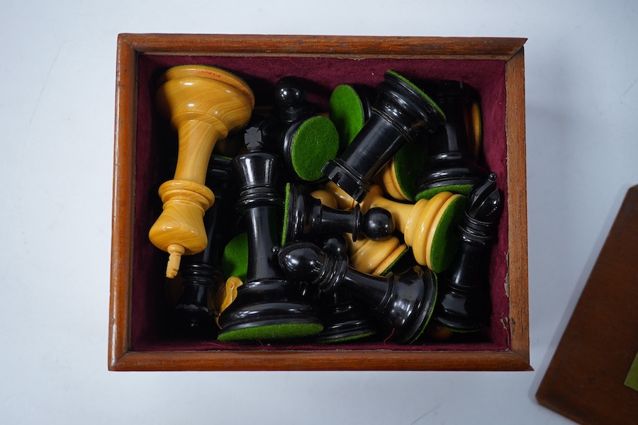 An early 20th century boxed J. Jaques & Son Staunton chess set, ebony and boxwood pieces, contained within the original velvet lined teak box with sliding lid and paper label to lid with facsimile of Howard Staunton sign